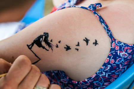 Bird Tattoo Ideas for Neck photo.