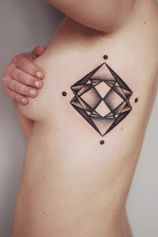 Women with diamond tattoo on naked body photo