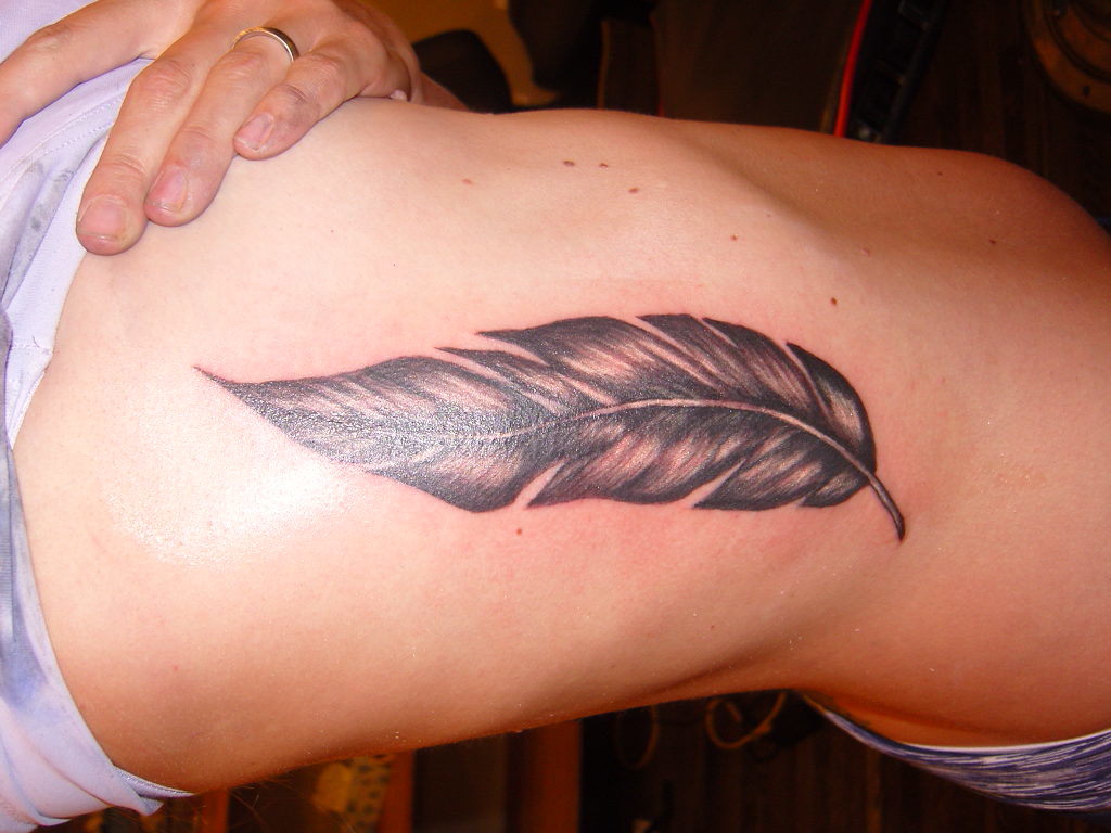 Exploring Unique Tattoo Ideas with Delicate Feathers photo.