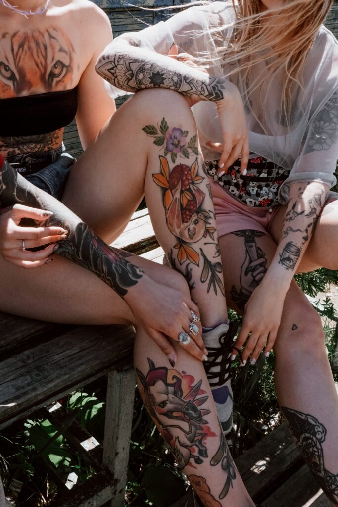 2 girls with beautifull love tattoos