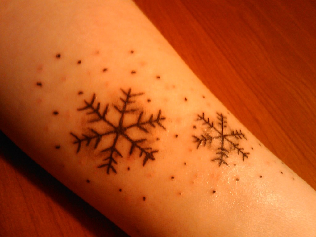 Small Tattoo Designs Capturing the Beauty of Winter photo