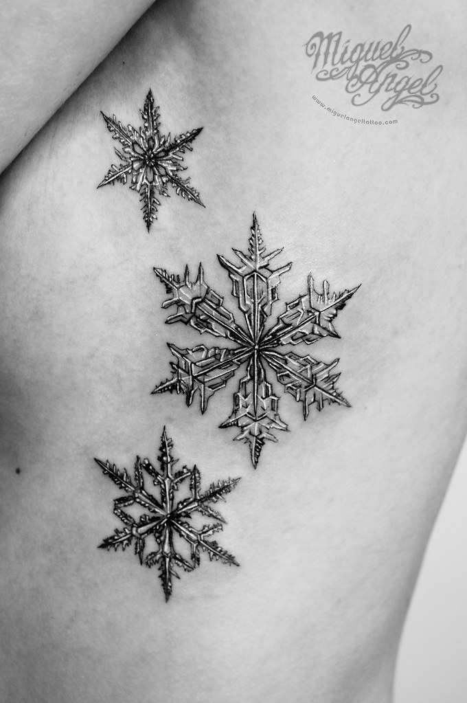 Tiny Snowflake Tattoos for a Touch of Delicate Charm photo.